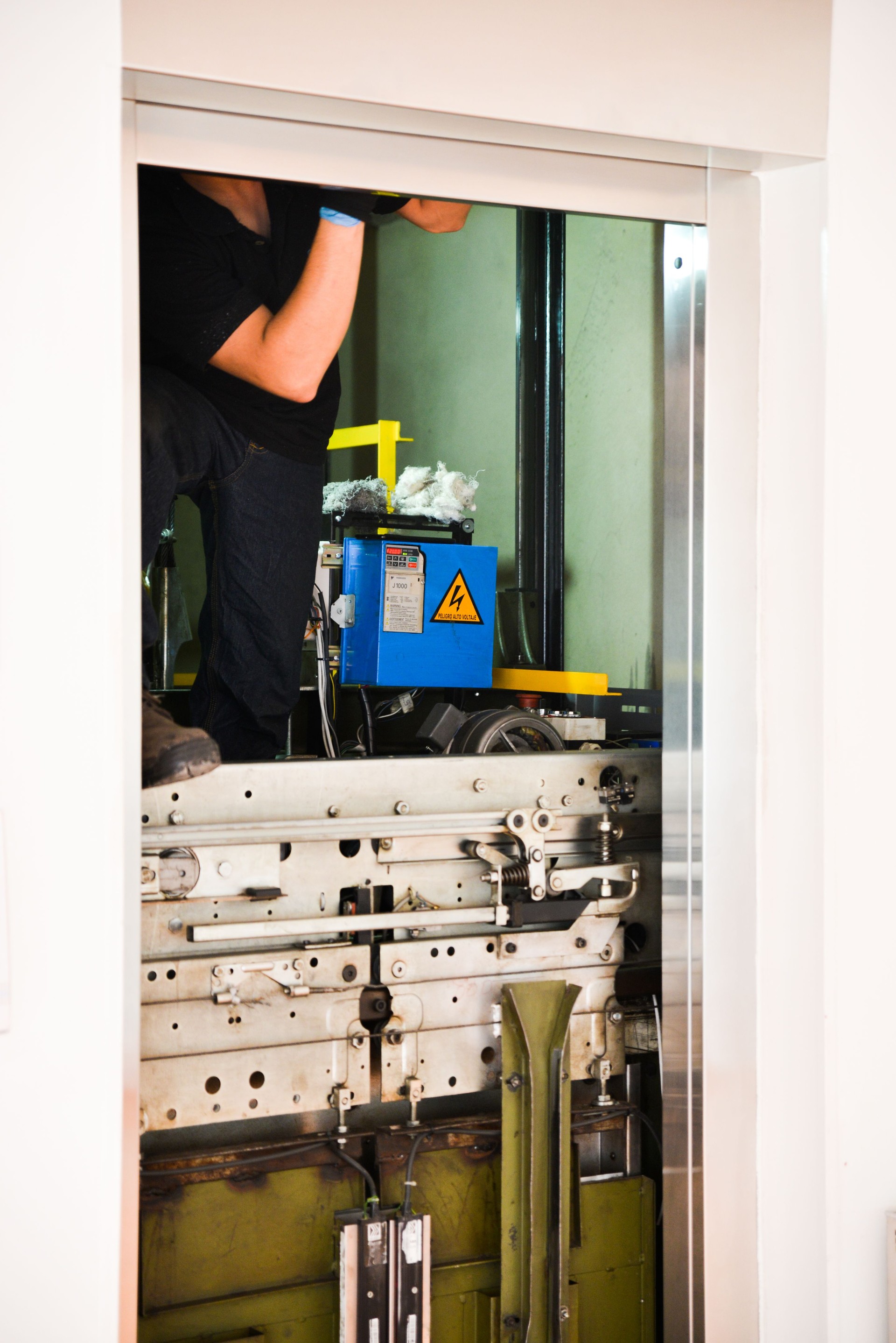 A man fixing a lift