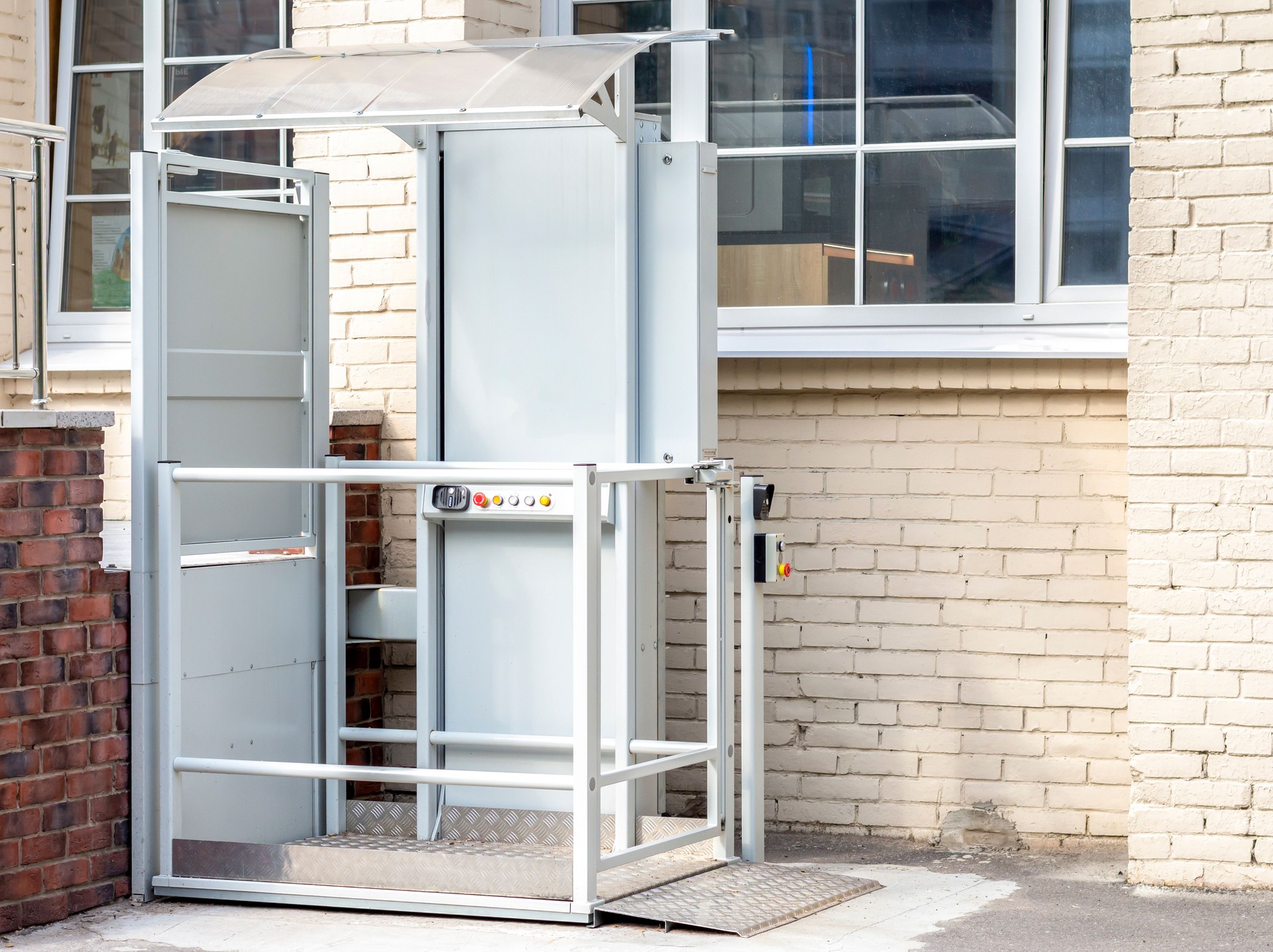 Stair lift for disabled people. Wheelchair lift. A mechanical chair lift that lifts disabled or elderly people up and down.
